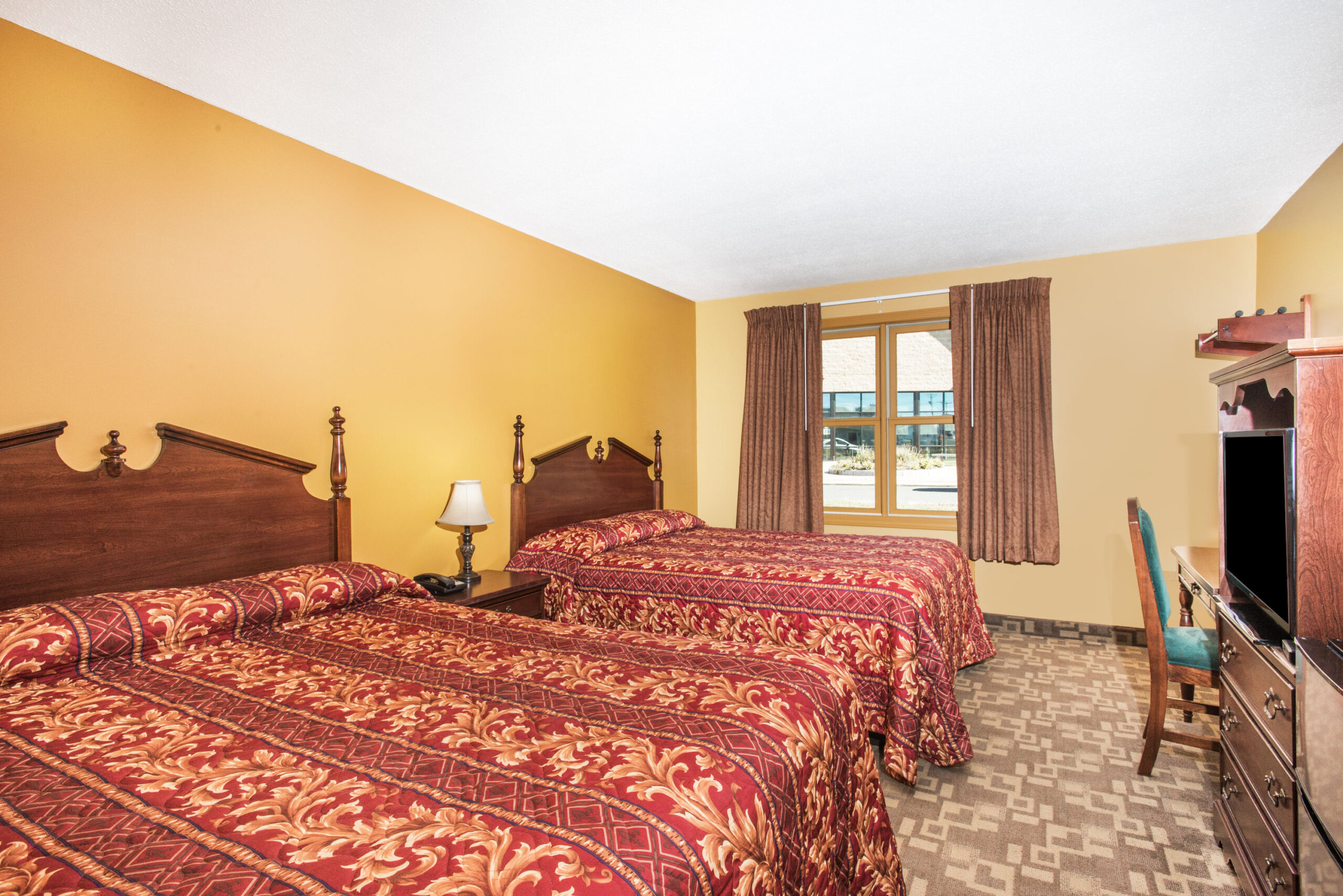 Hotel room with two double beds.