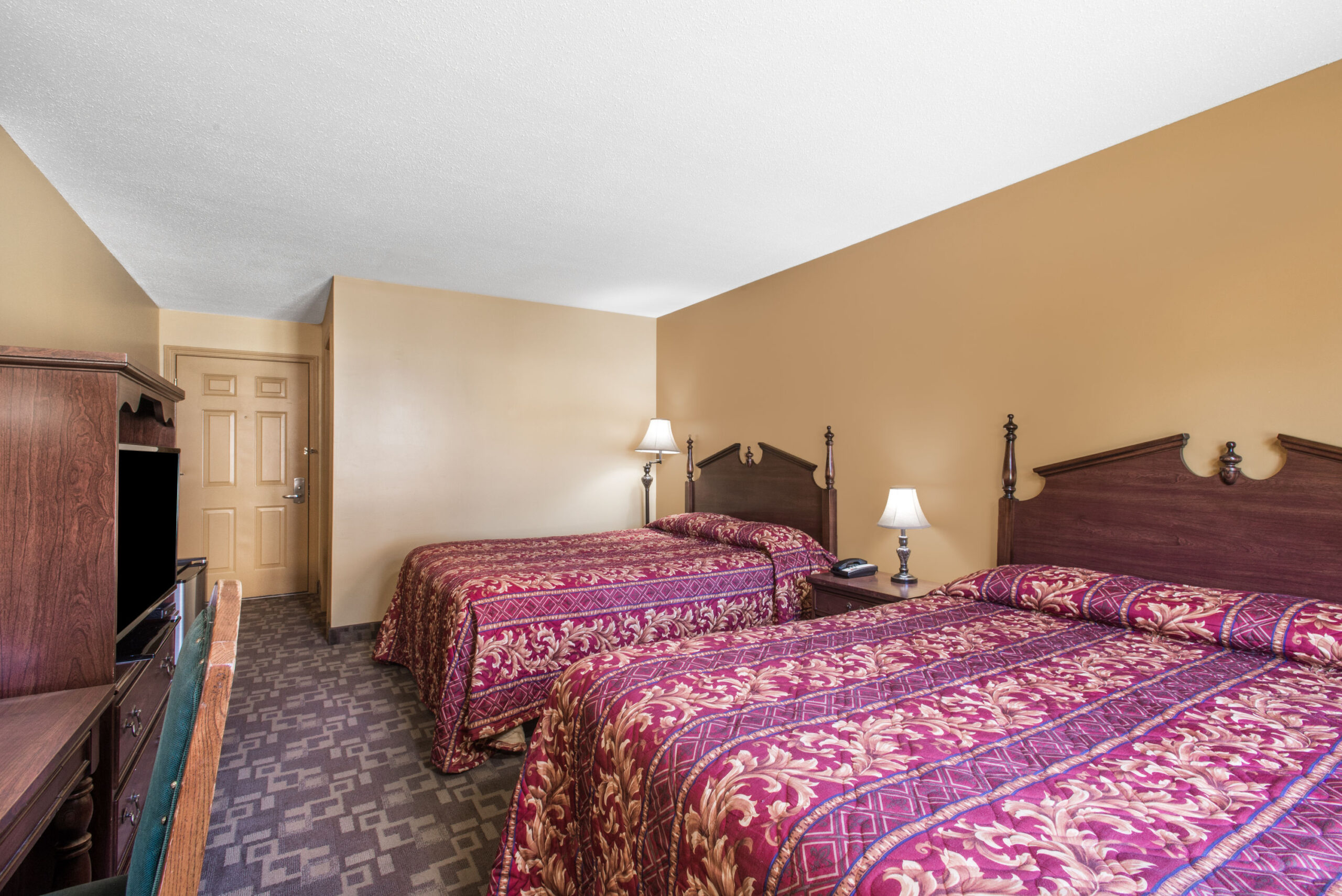 Hotel room with two double beds.