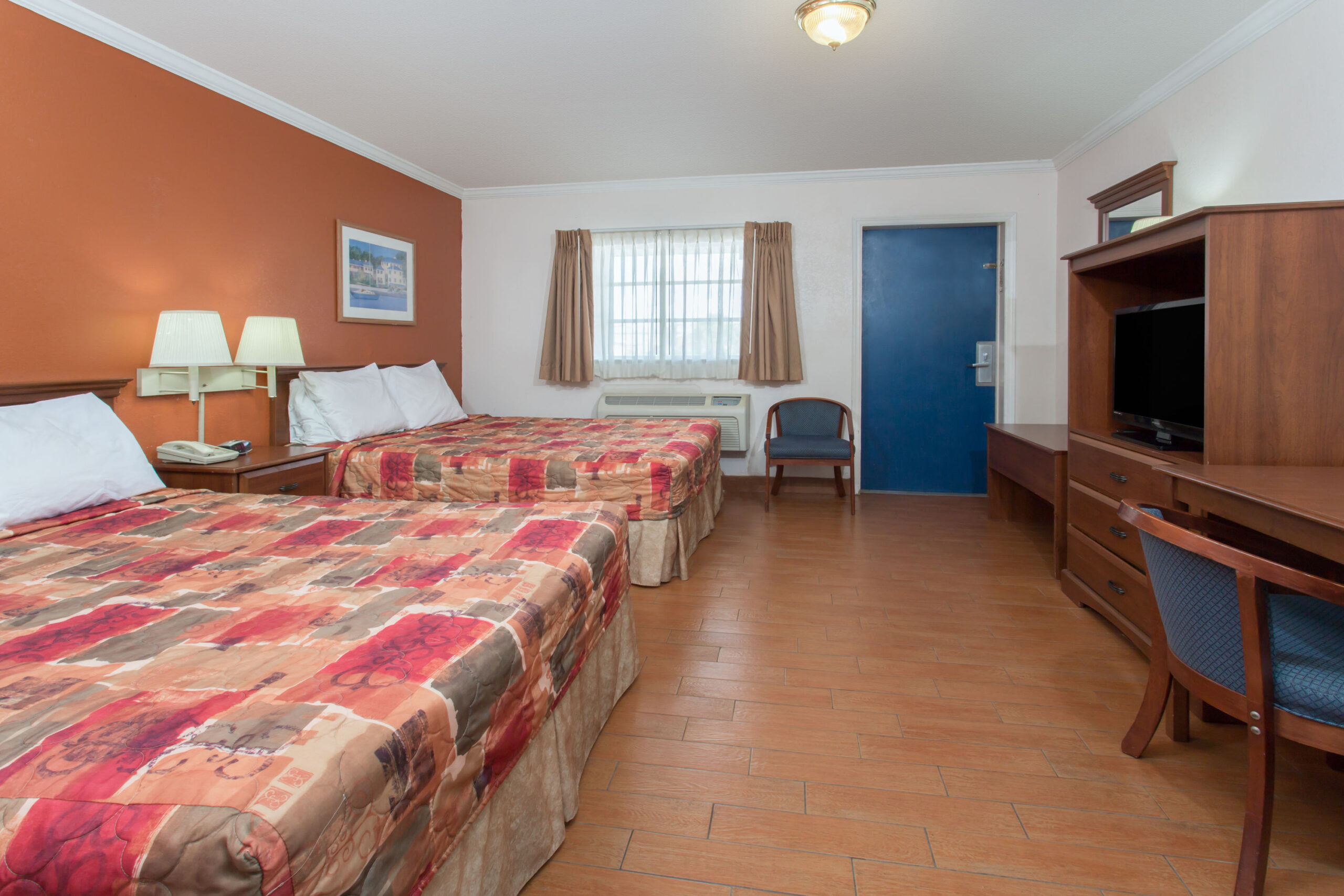 Hotel room with two double beds.