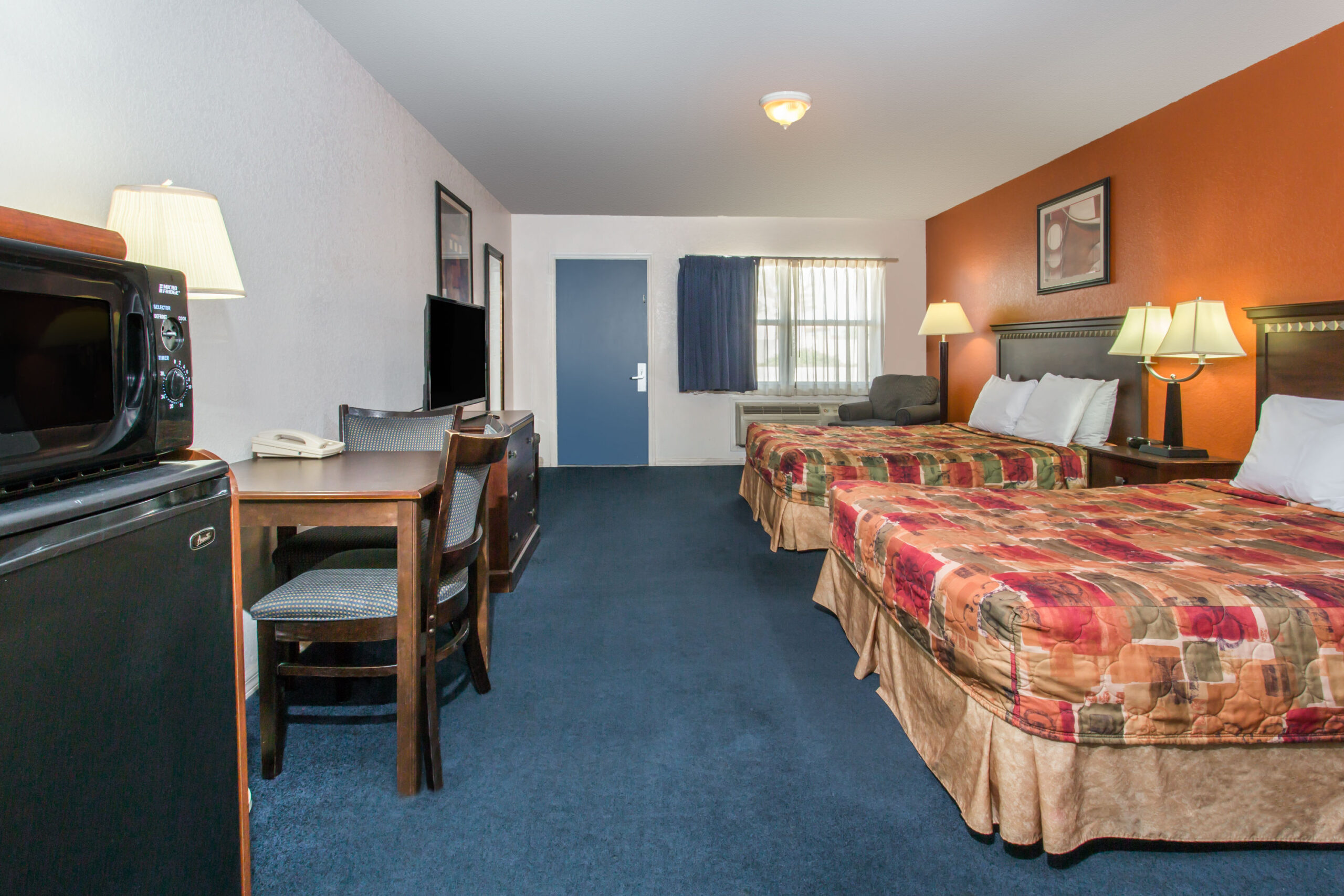Hotel room with two double beds.
