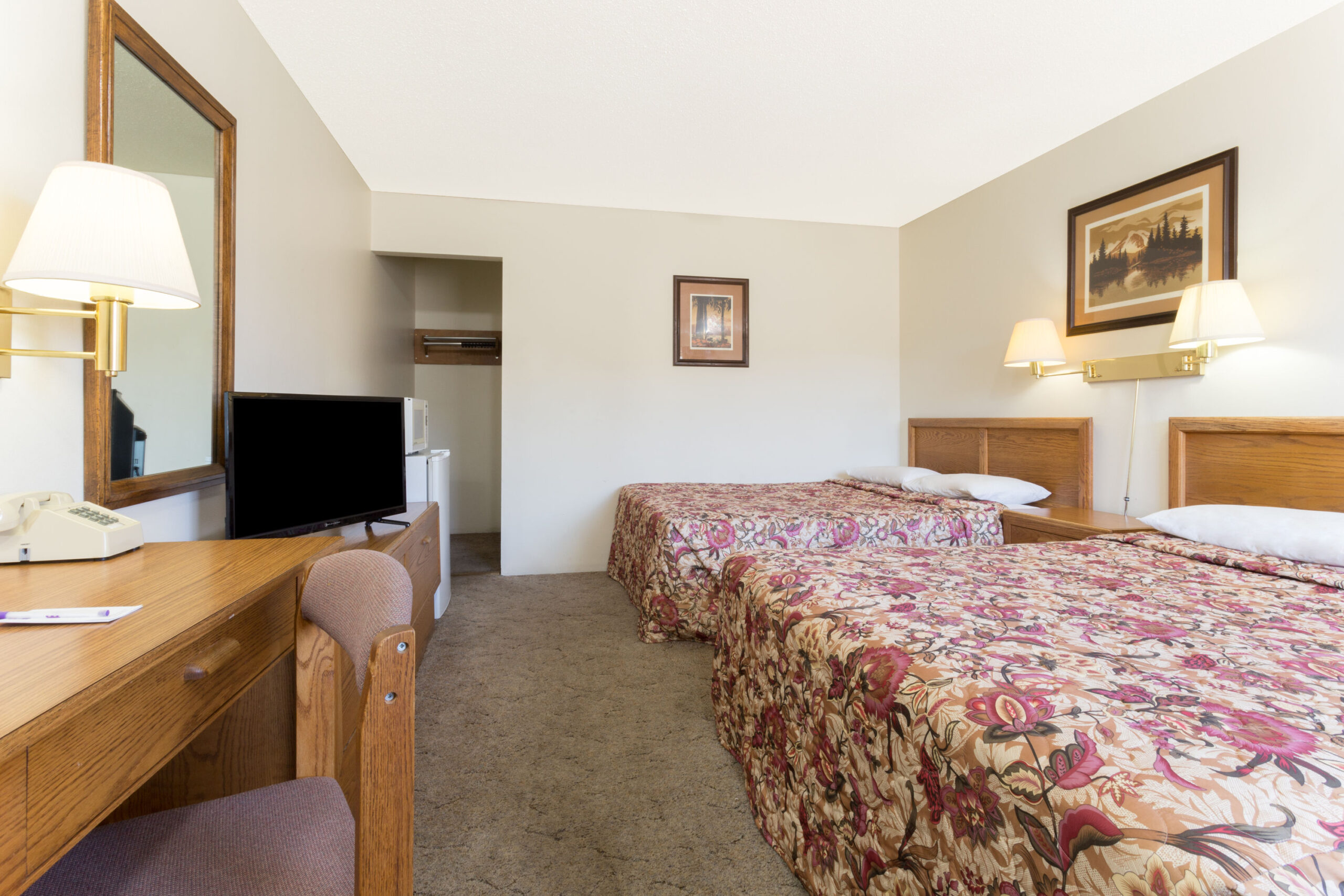 Hotel room with two double beds.