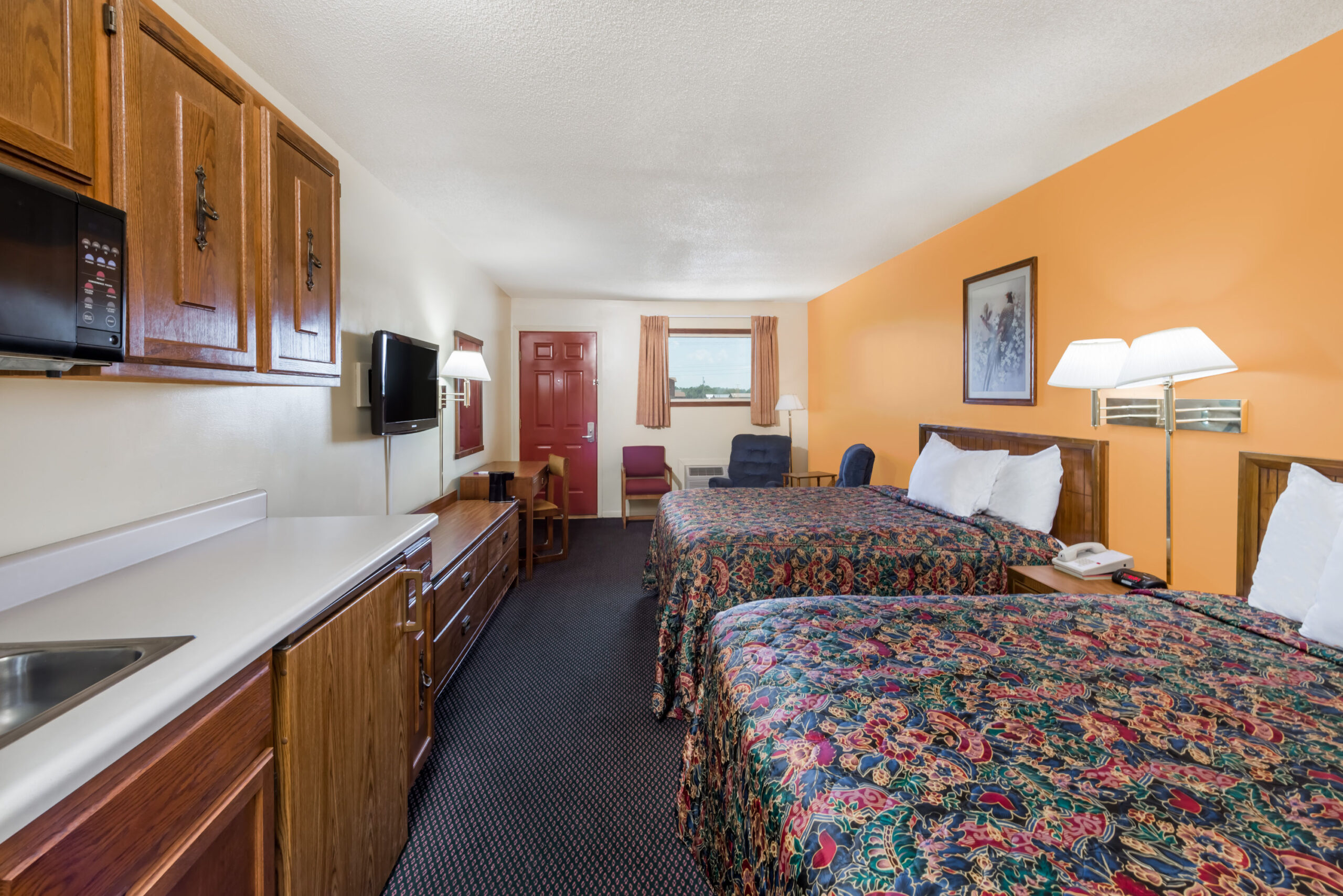 Hotel room with two double beds.