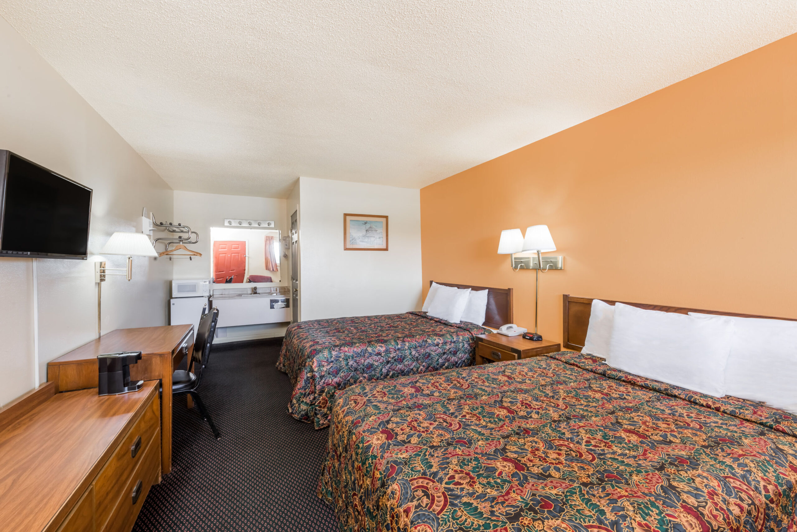 Hotel room with two double beds.
