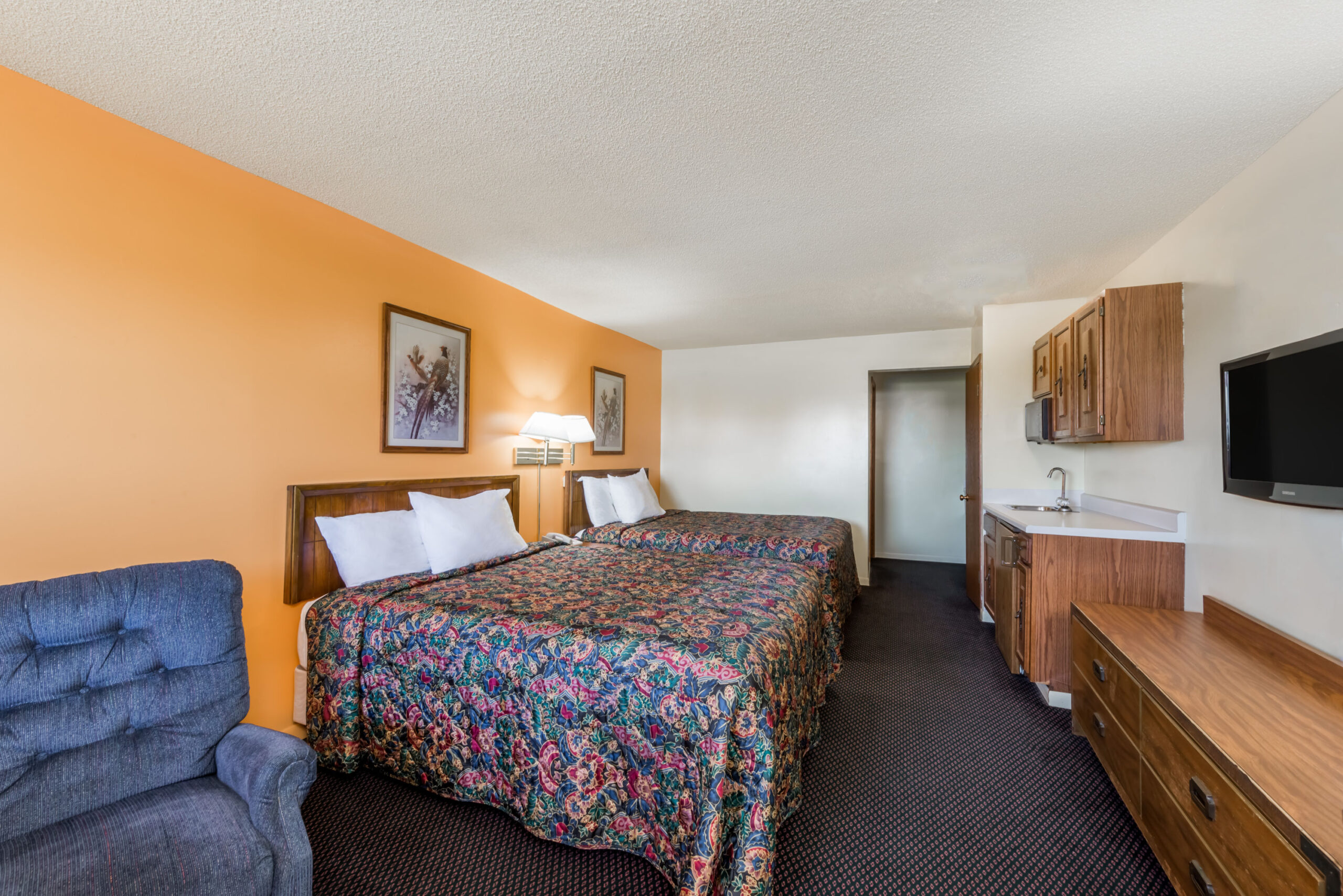 Hotel room with two double beds.