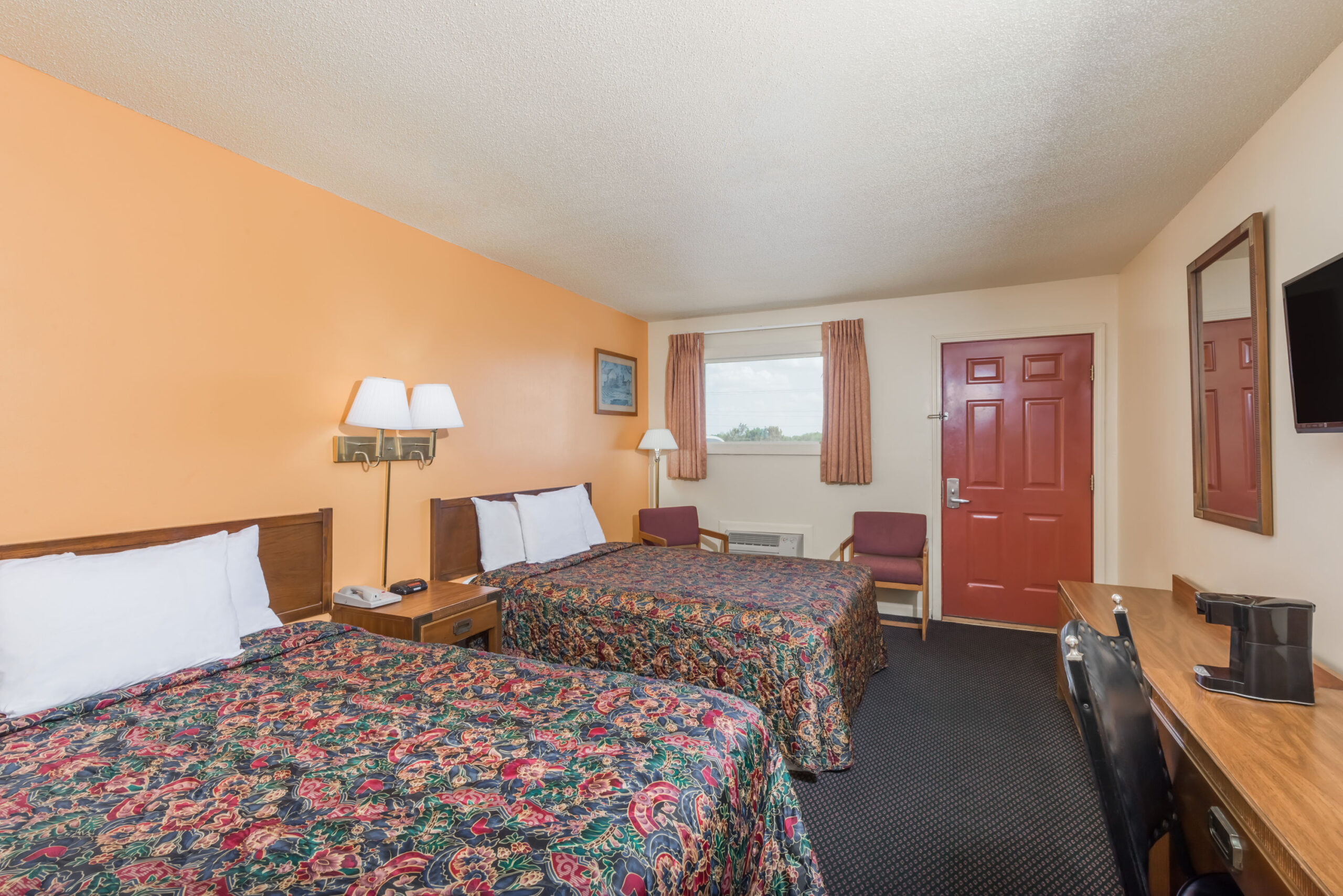 Hotel room with two double beds.