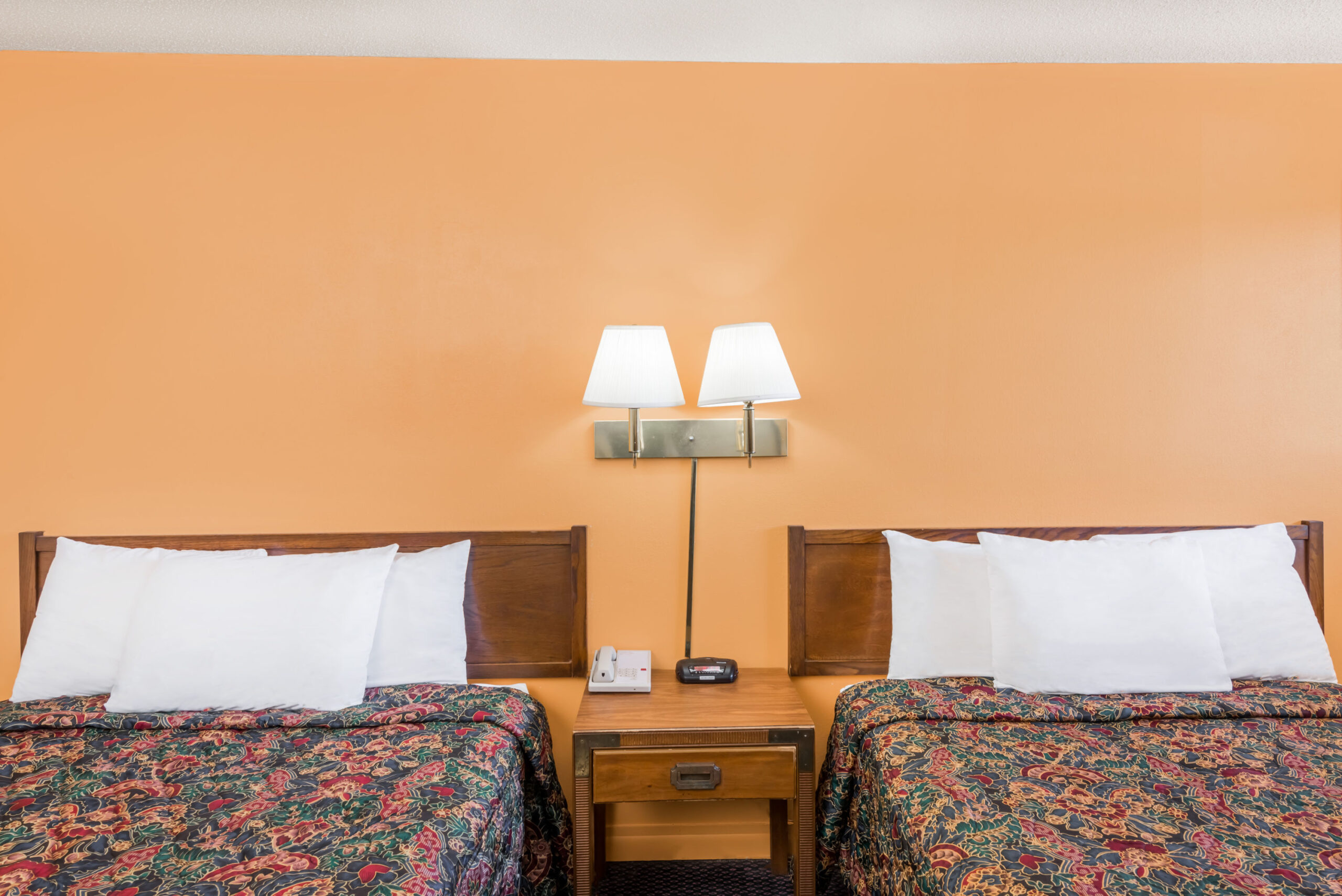 Hotel room with two double beds.
