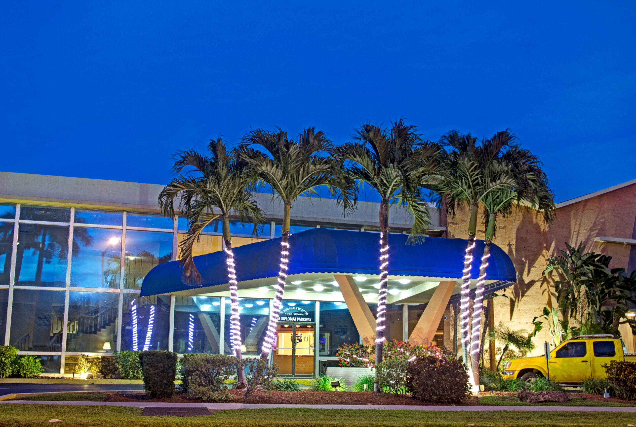 Hotel exterior at nightfall.