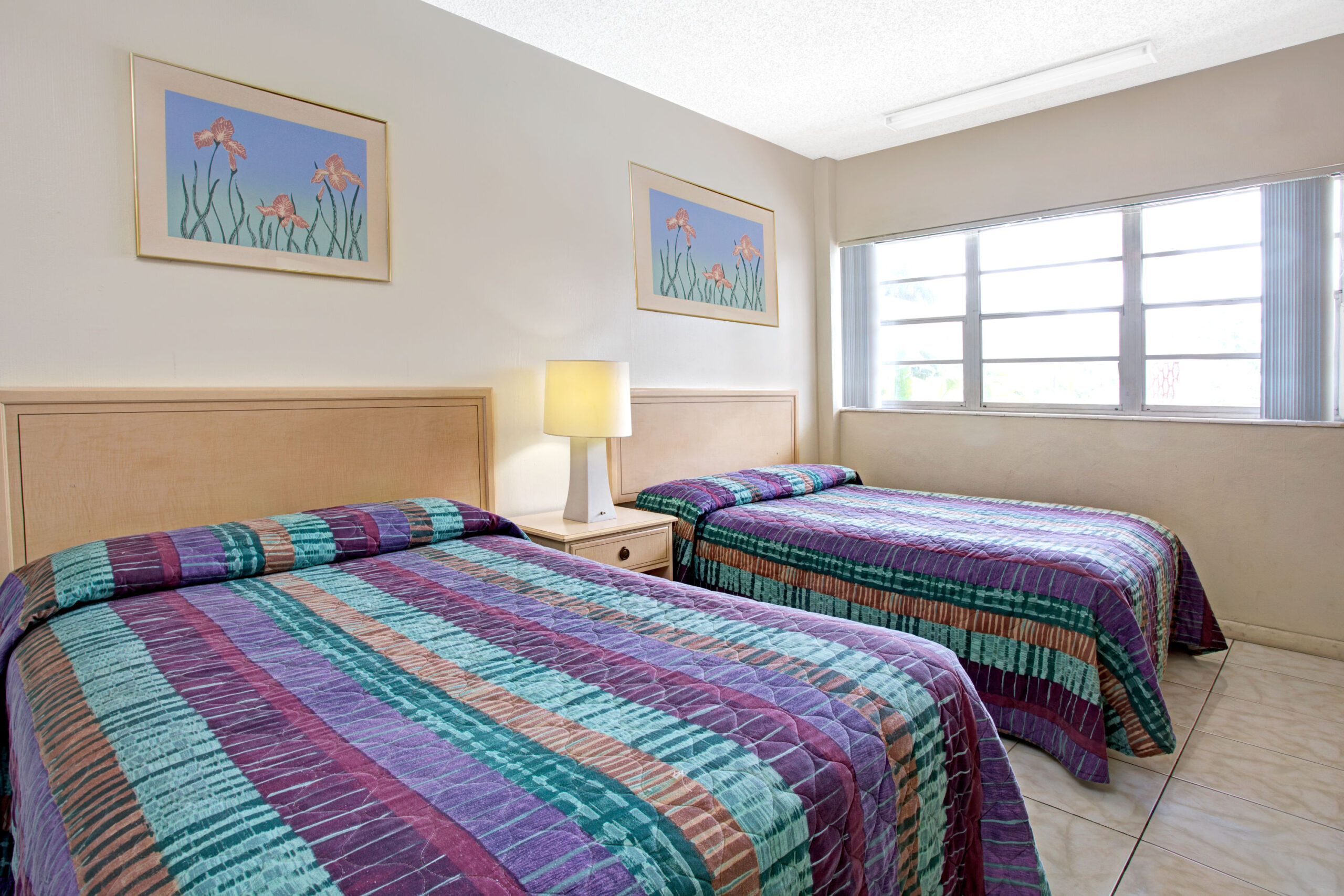 Hotel room with two double beds.