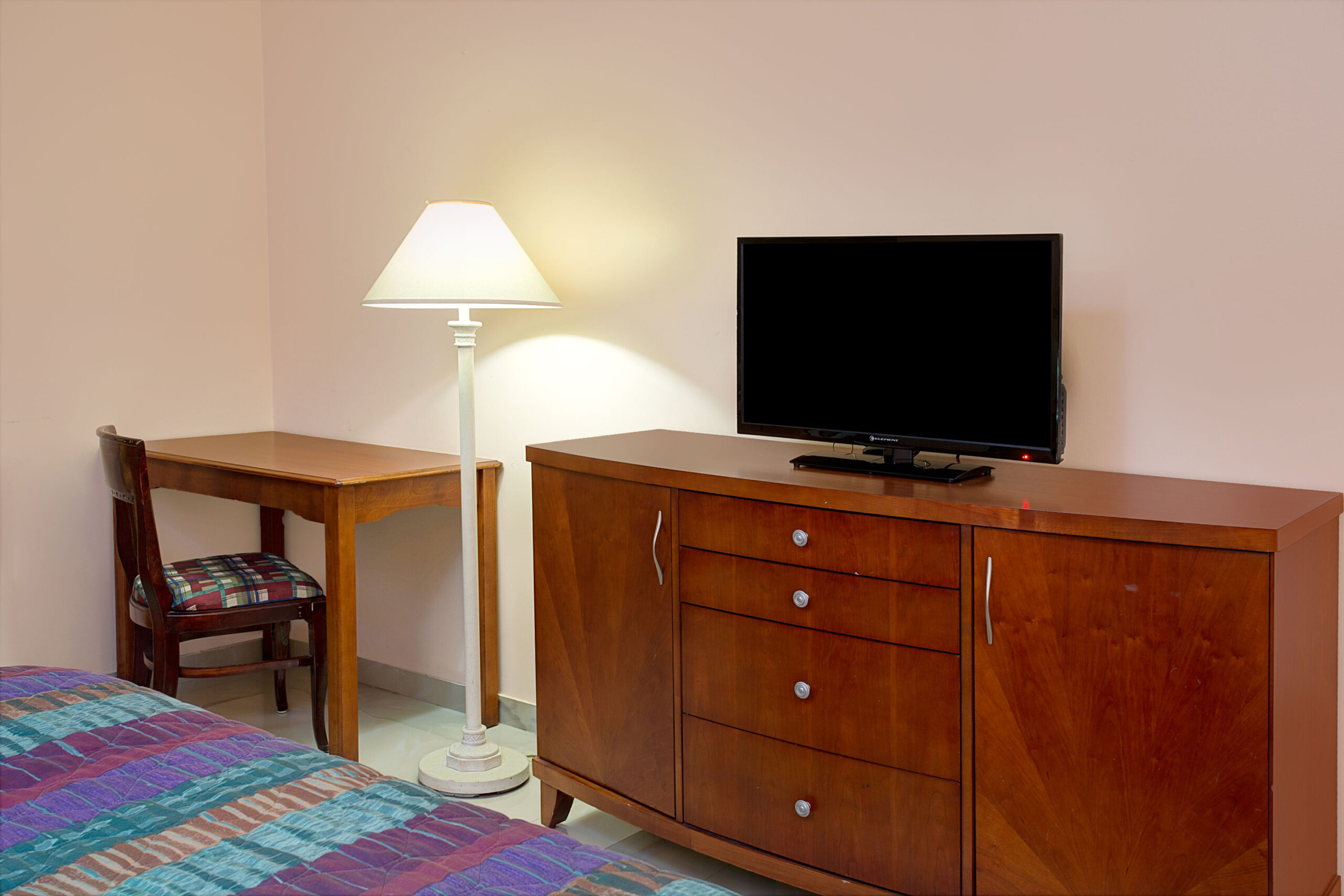Hotel room TV and storage area.