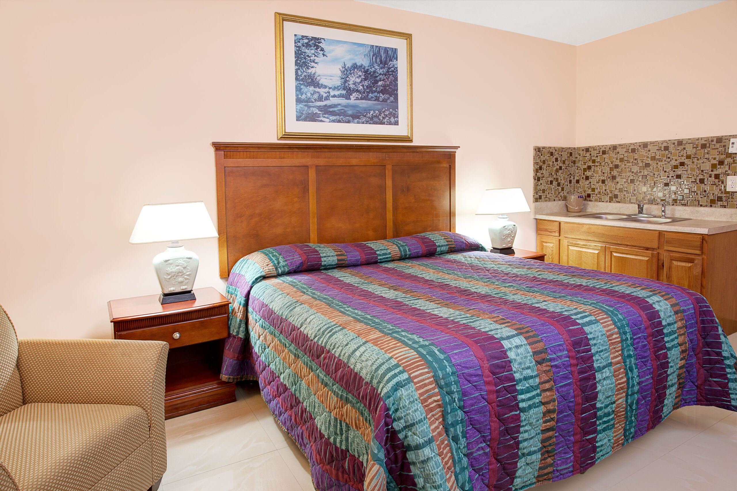 Hotel room with a queen bed.