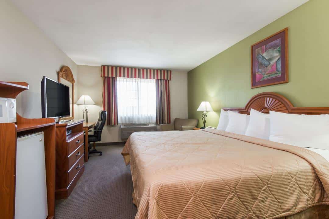 Hotel room with a king bed.