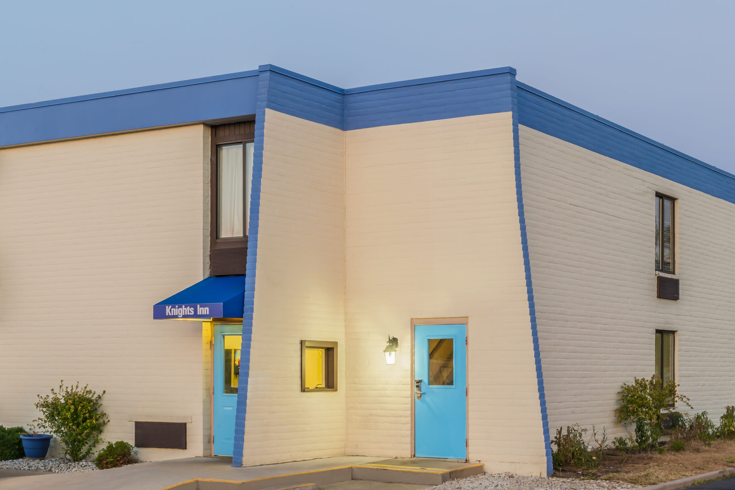 Hotel exterior at night.