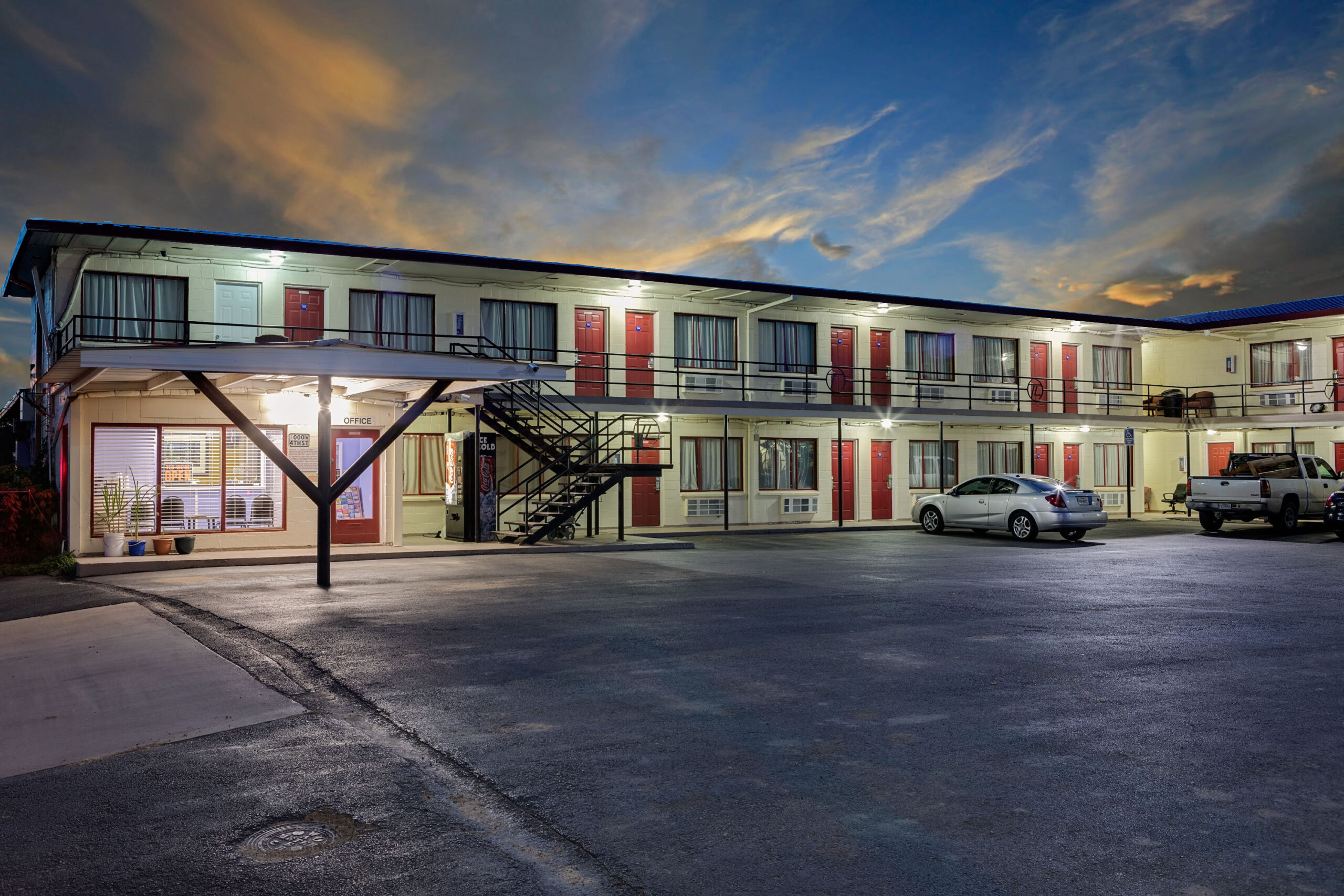 Exterior view of Knights Inn building at night.