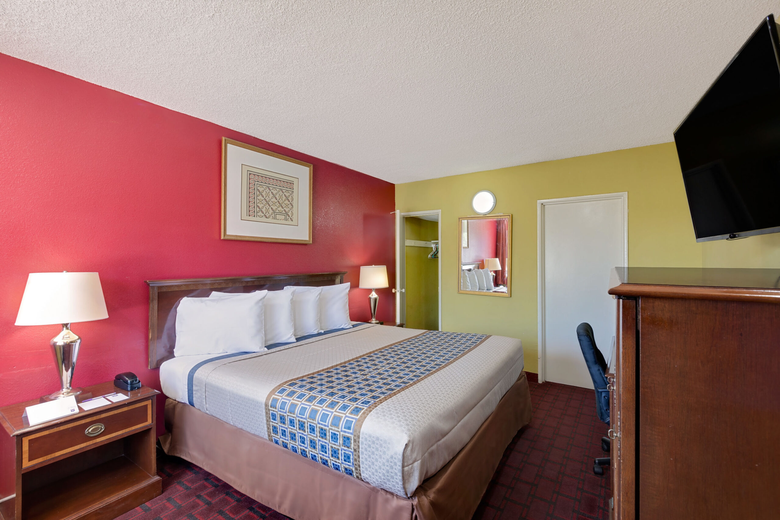 Hotel room with king-size bed.