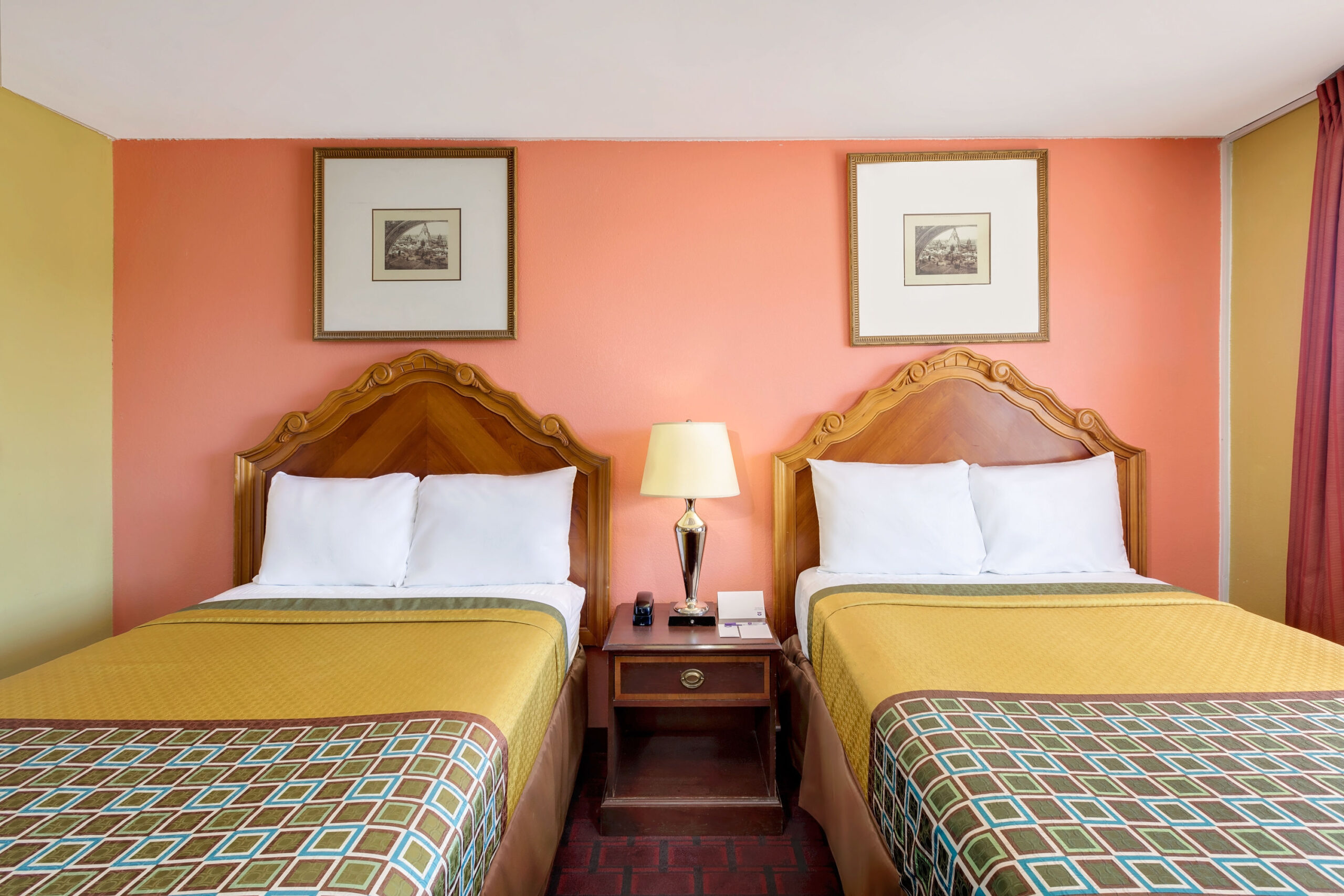 Hotel room with two double beds.