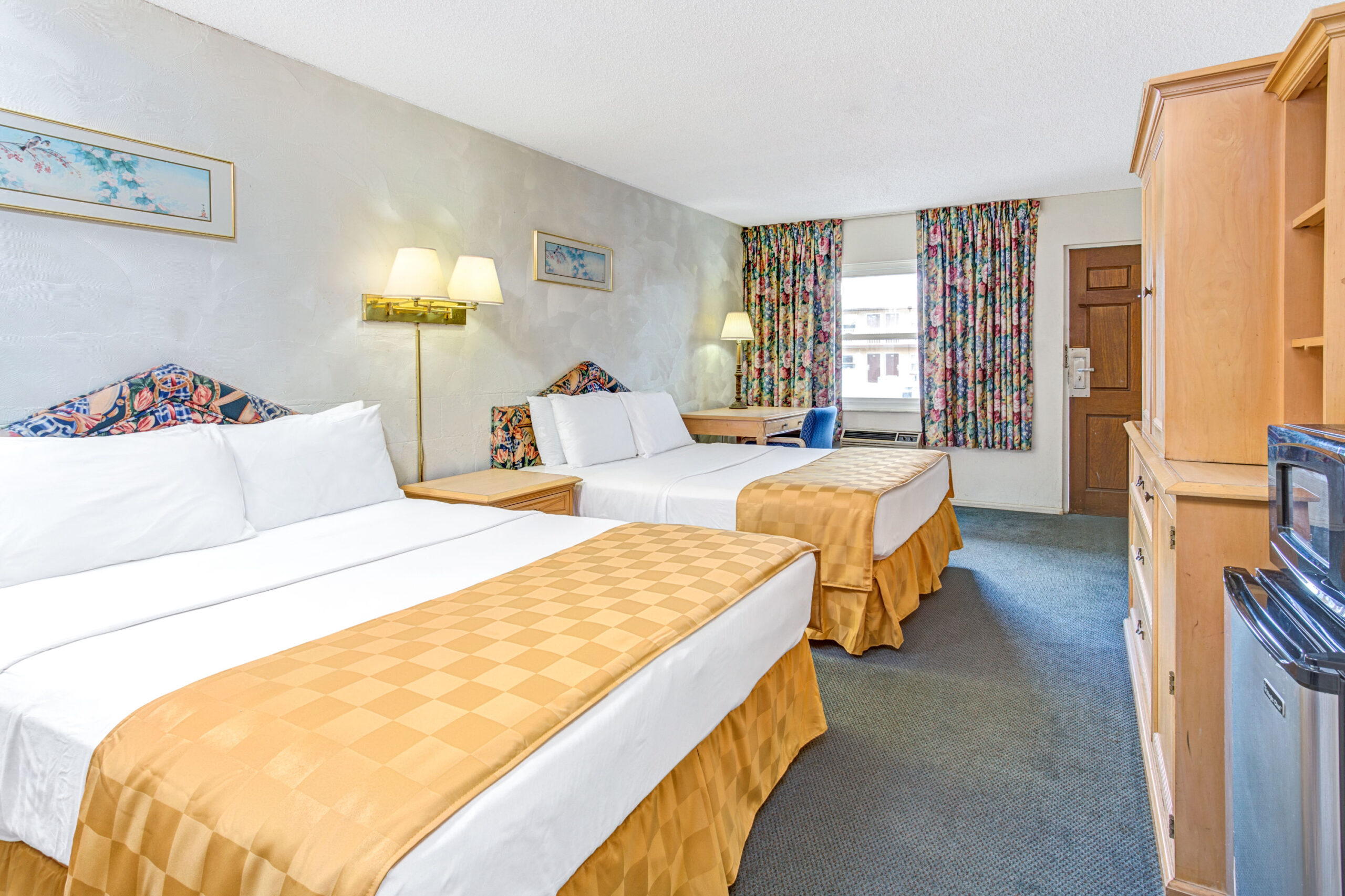 Hotel room with two double beds.