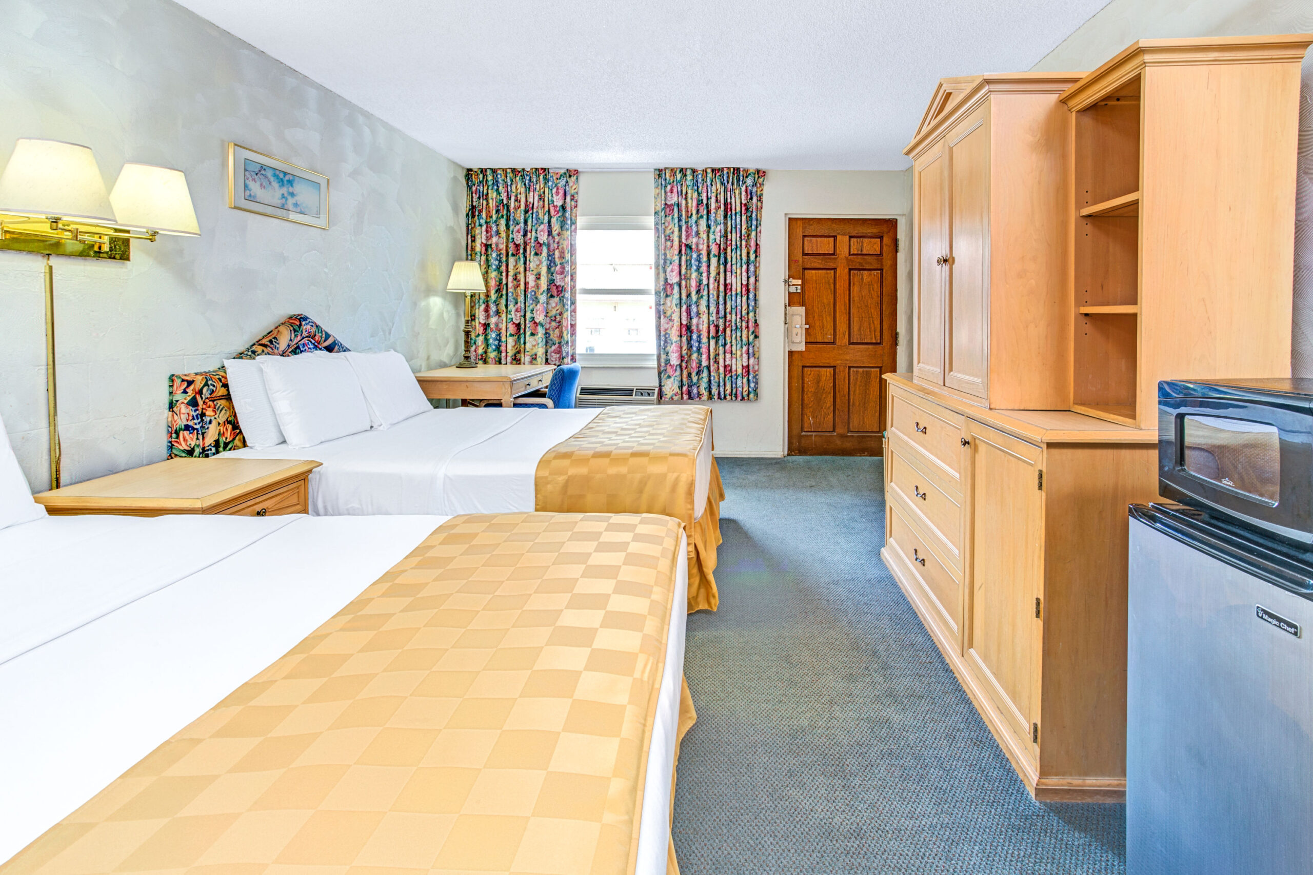 Hotel room with two double beds.