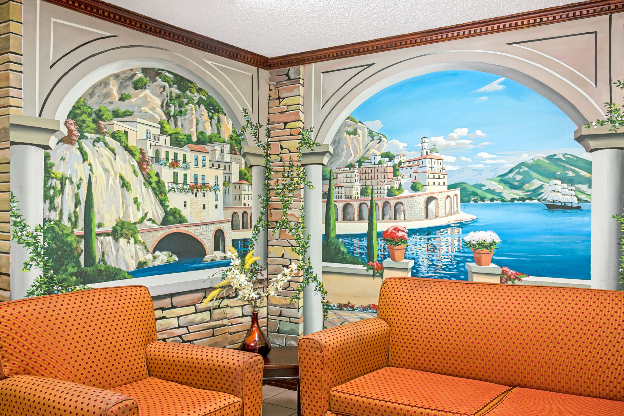 Hotel lobby with colorful paintings.