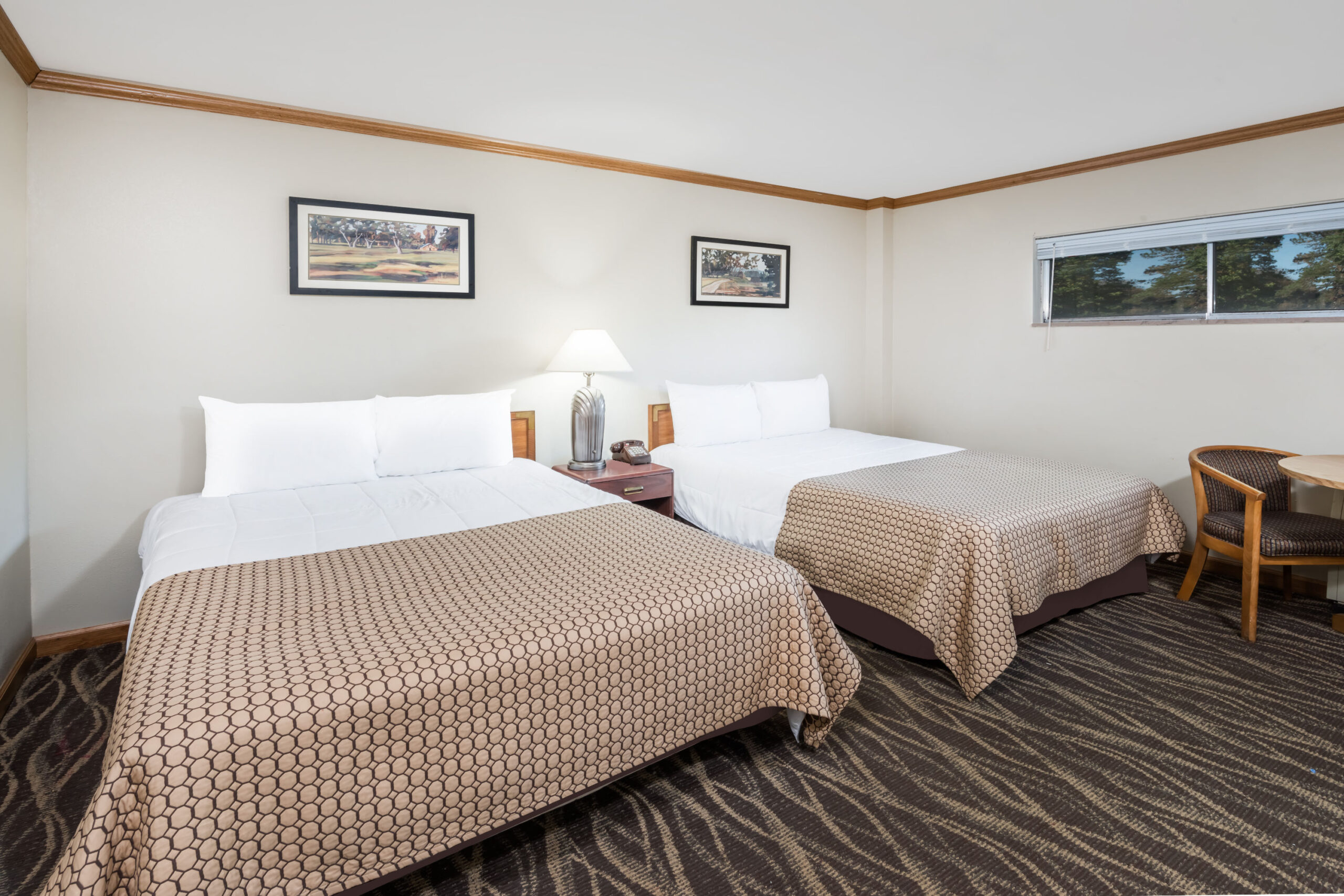 Hotel room with two twin beds.