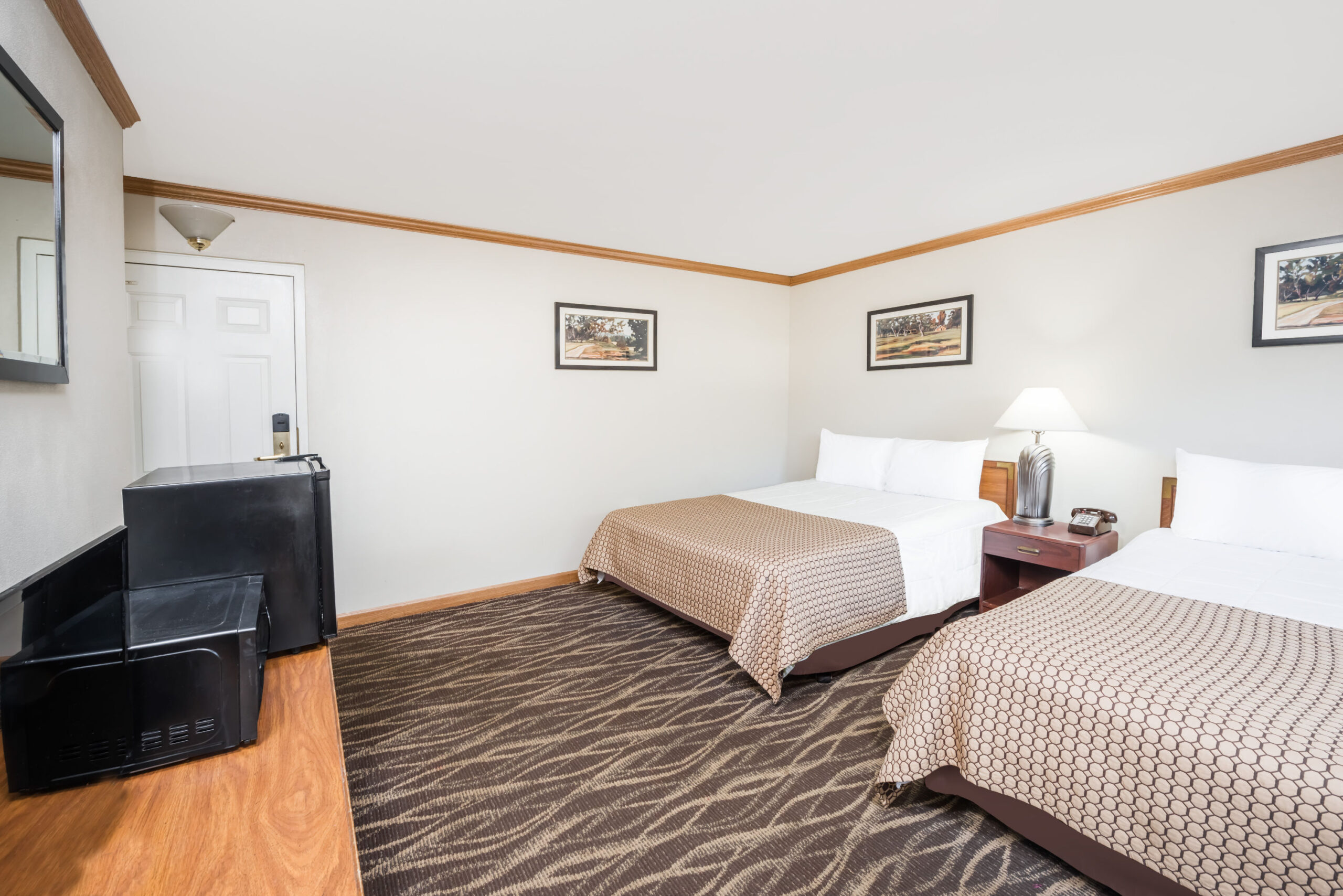 Hotel room with two twin beds.