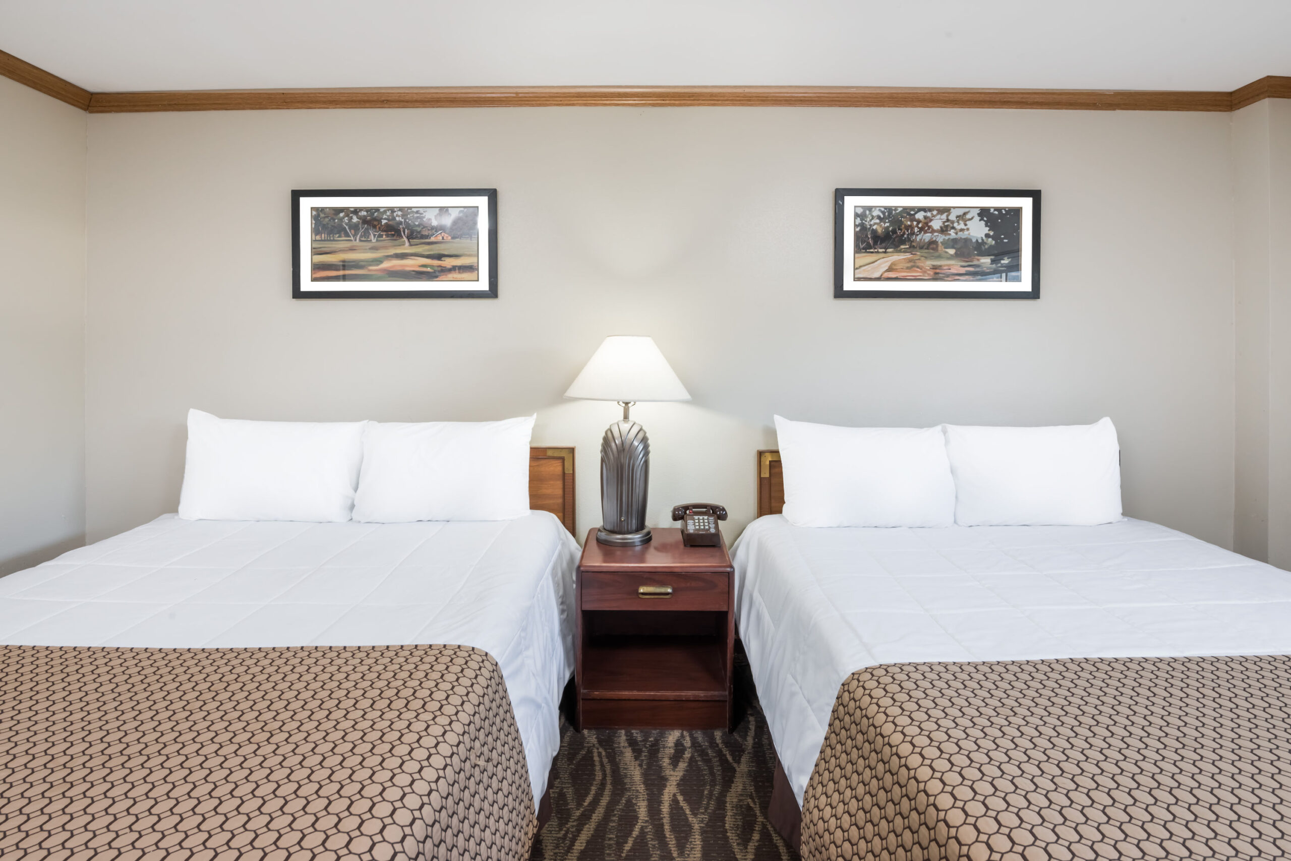 Hotel room with two twin beds.