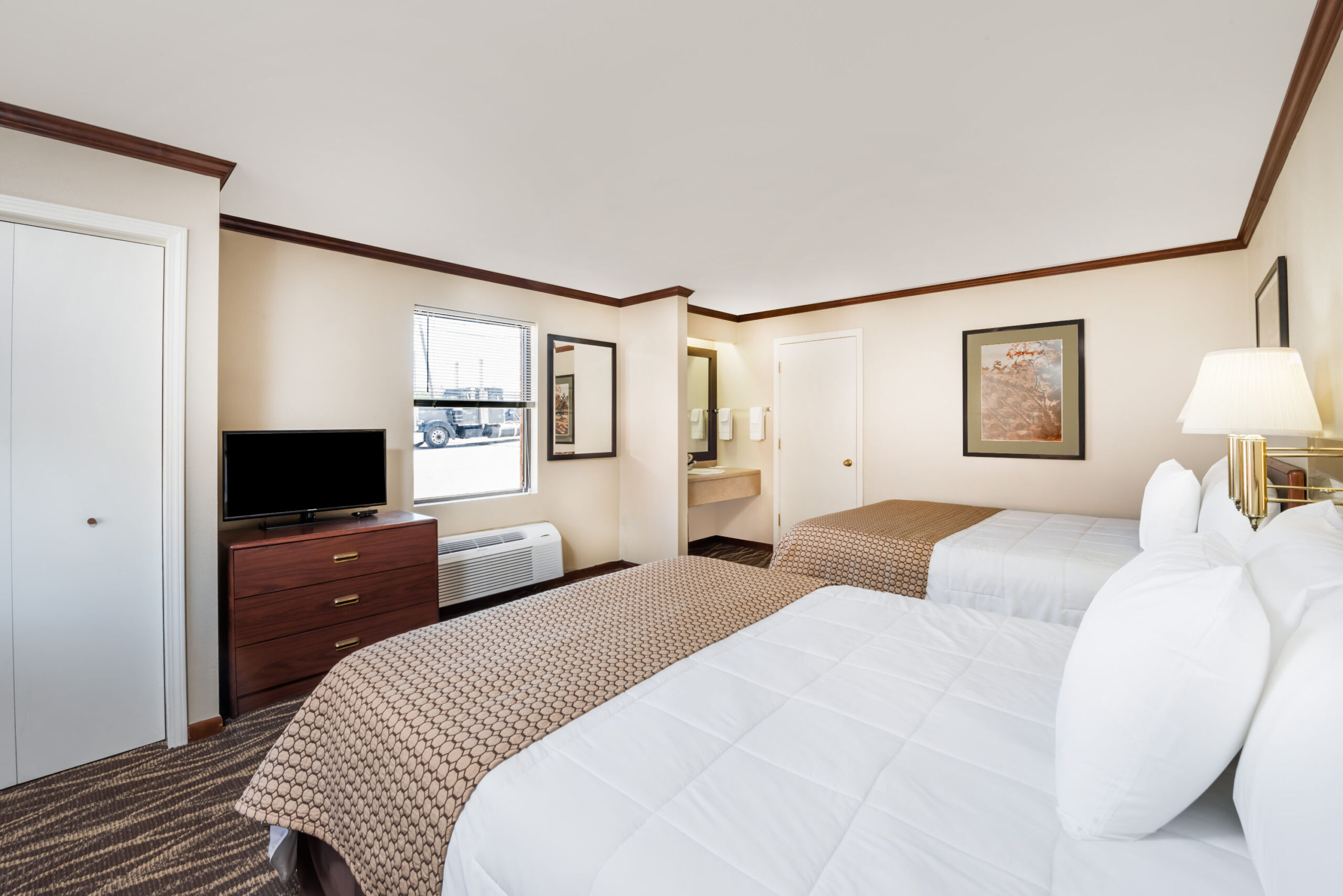 Hotel room with two twin beds.