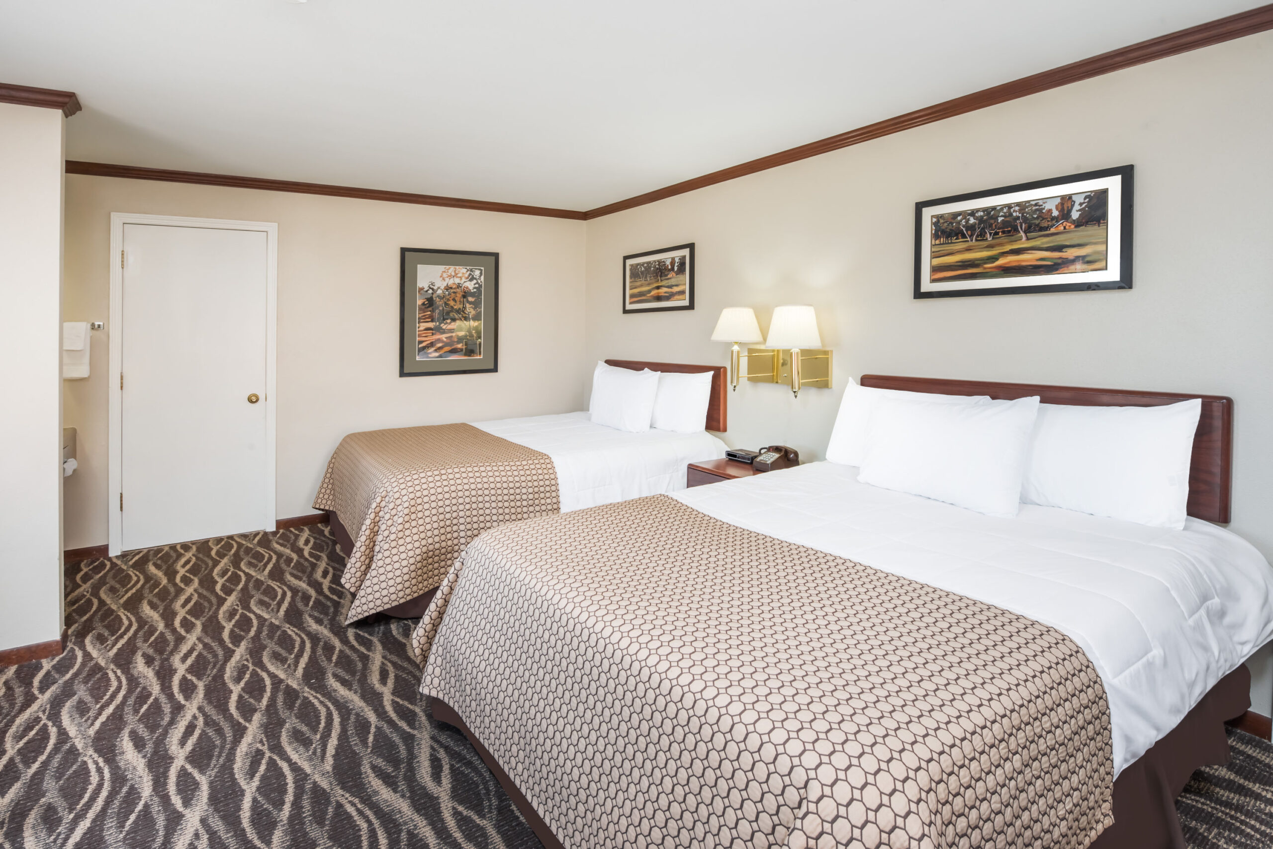Hotel room with two twin beds.