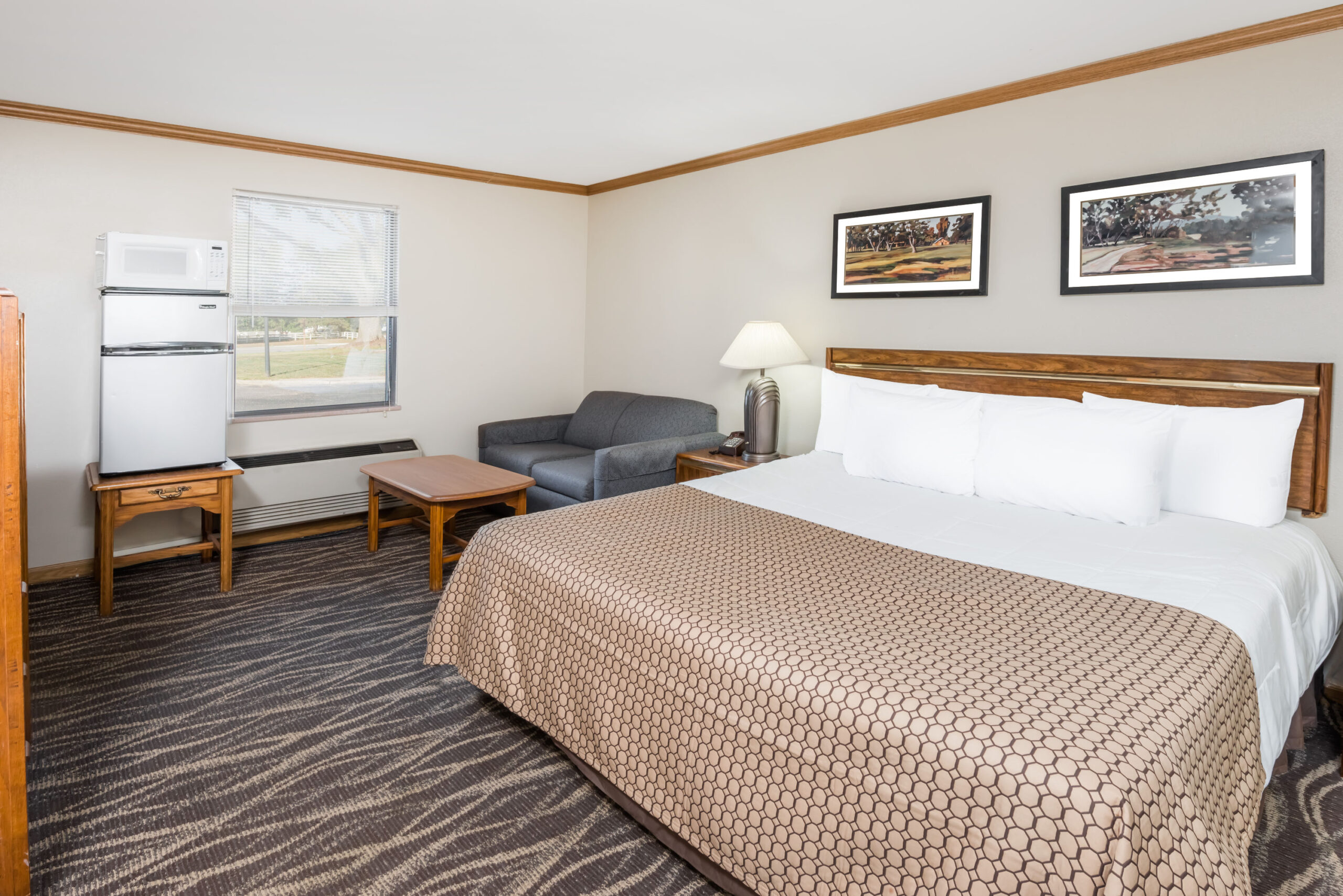 Hotel room with a queen bed.