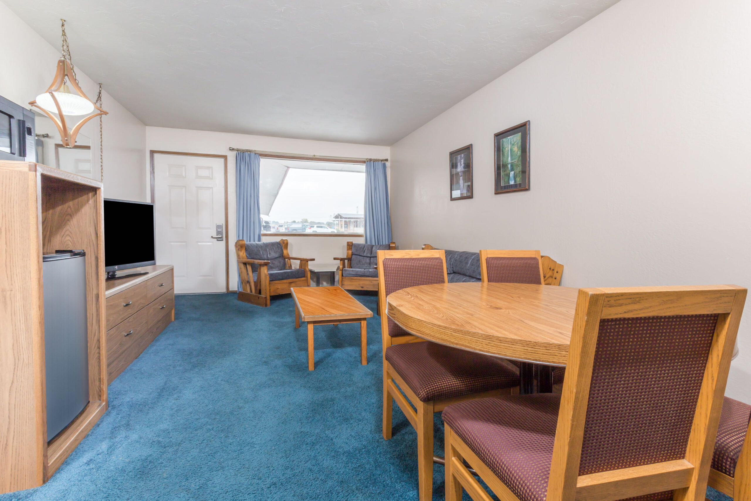 Hotel room seating and dining area.