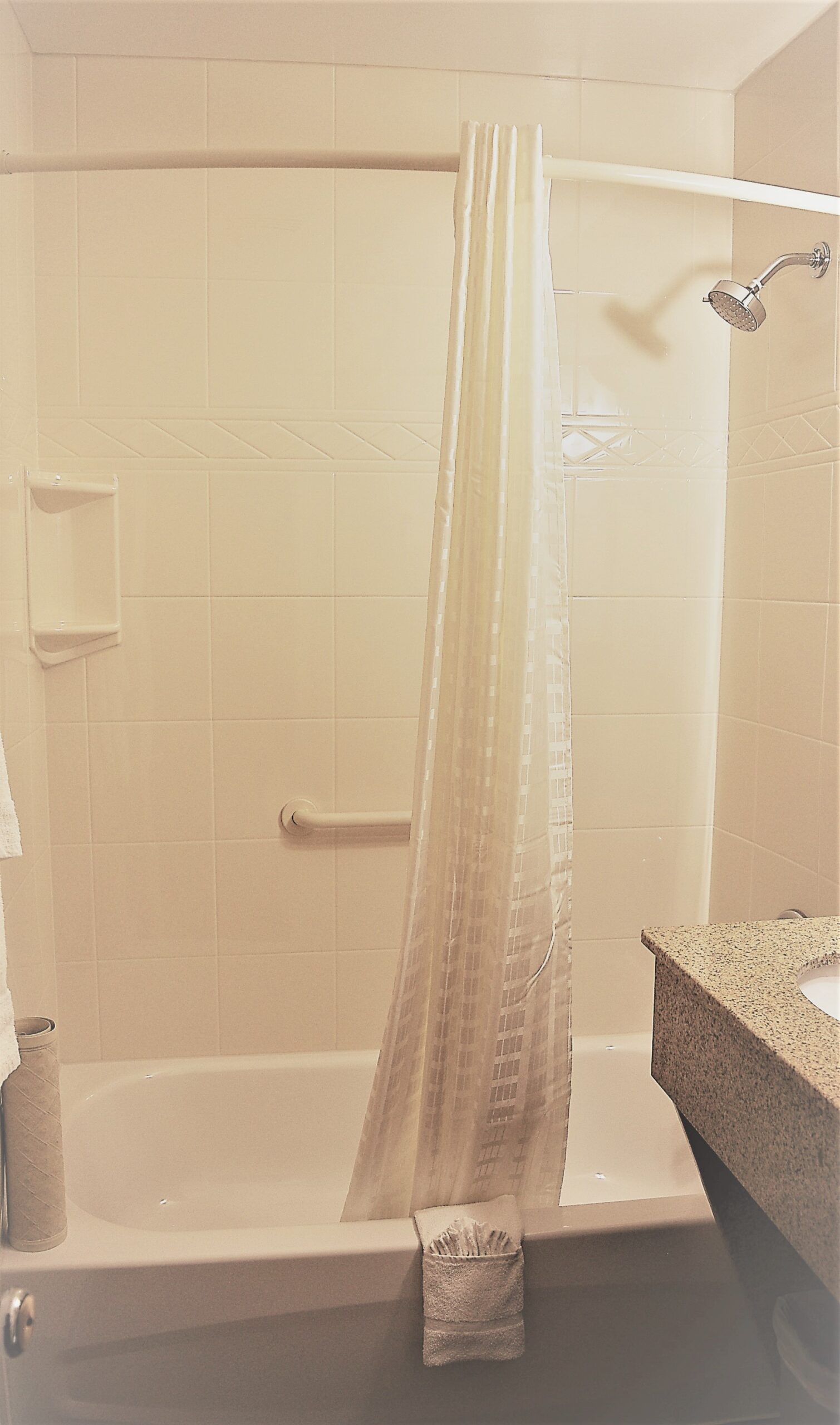 Bathroom with a shower and curtain.