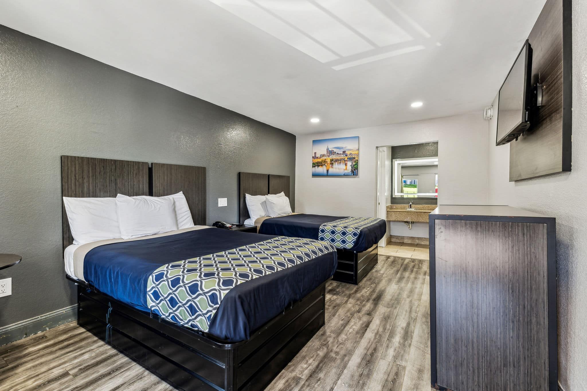 A guestroom with two beds at the Knights Inn Antioch hotel.