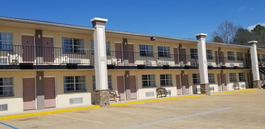 Hotel exterior at noon.