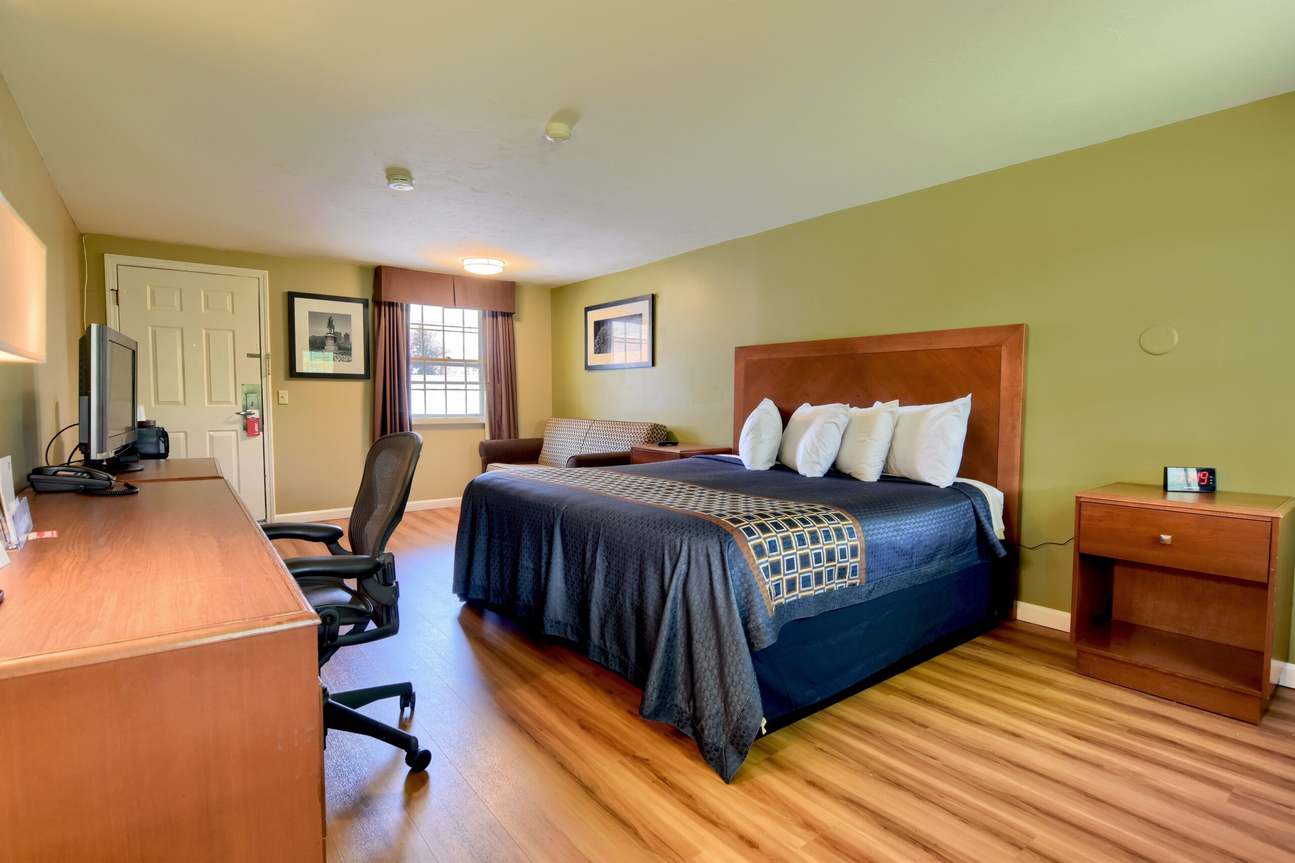 Hotel room with a king bed.