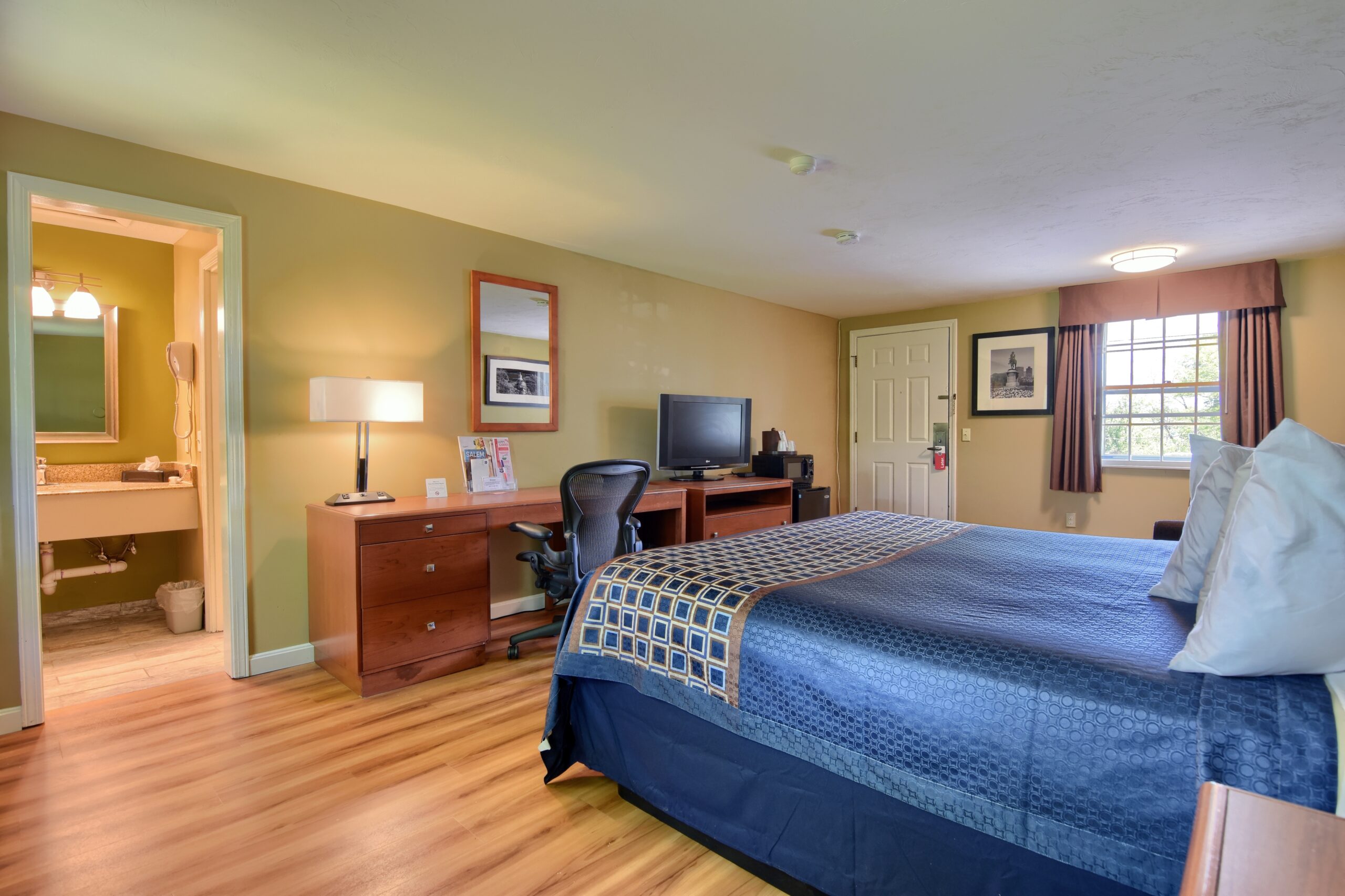 Hotel room with a king bed.