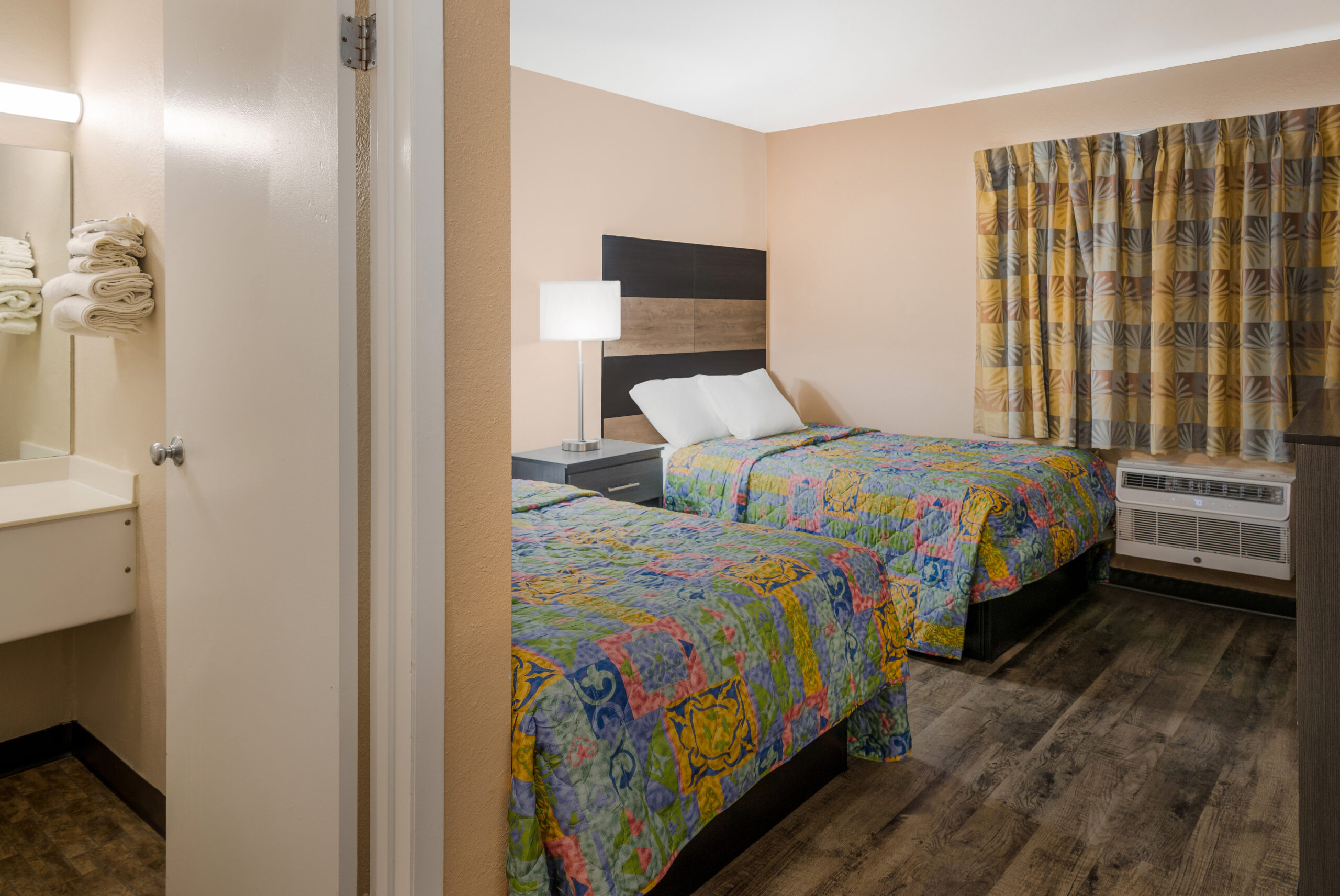 Hotel room with two double beds.