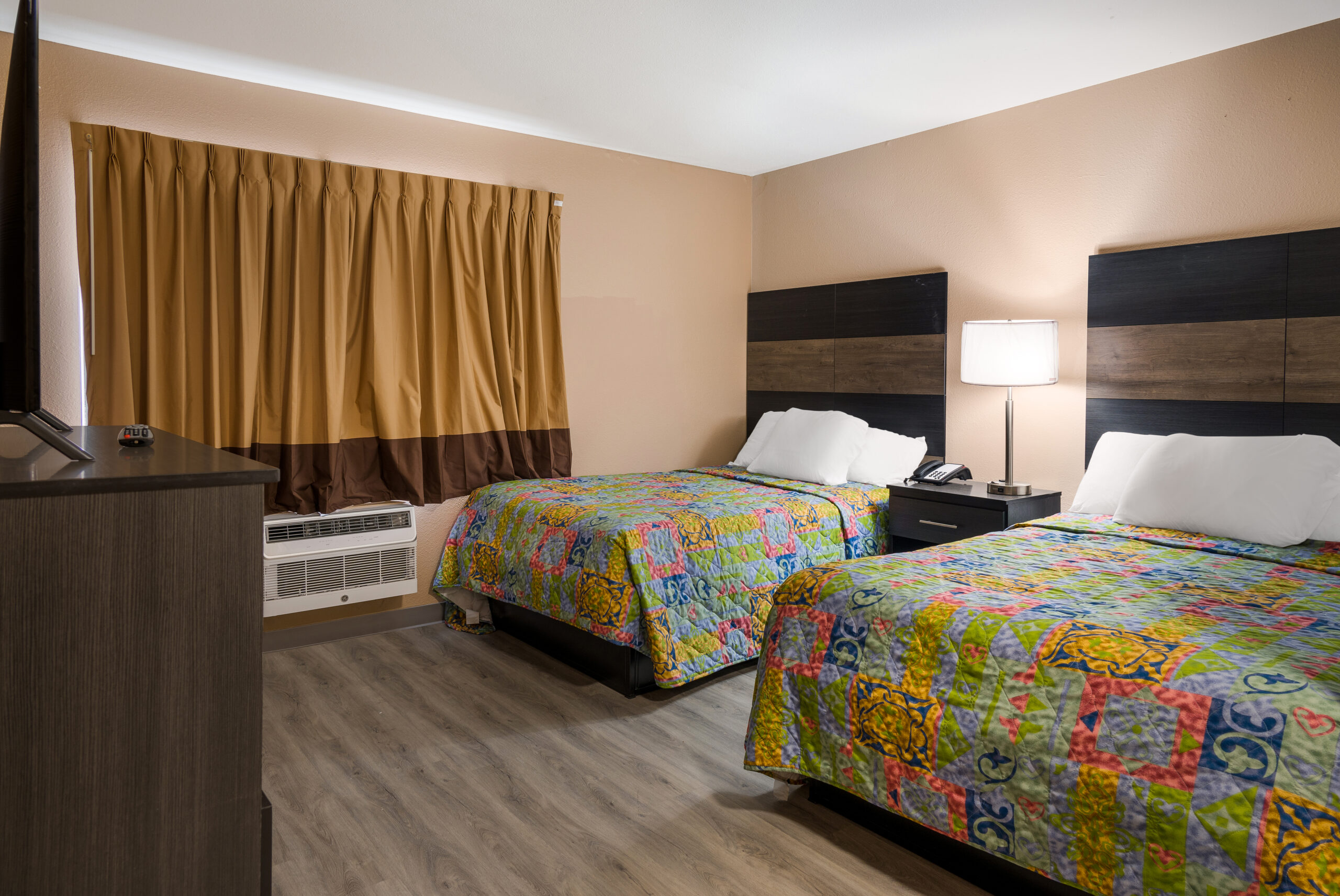 Hotel room with two double beds.